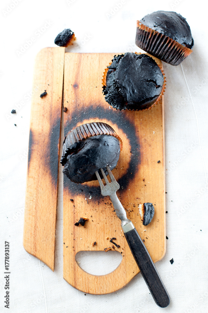 burned muffins - black cupcakes, failed baking, catastrophe in the kitchen, burned on charcoal