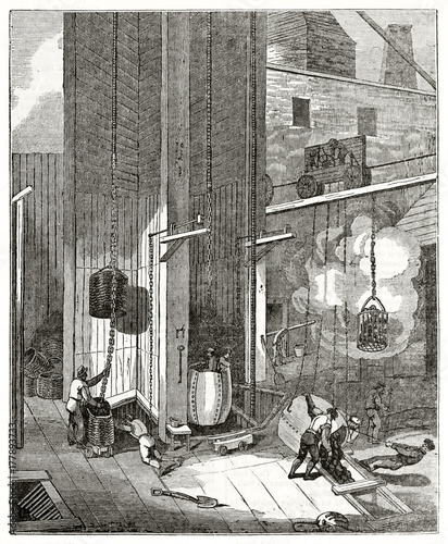 Old grayscale illustration of workers in South Hetton colliery next to the mouth of coal pit, United Kingdom. By unidentified author, published on  Penny Magazine, London, 1835