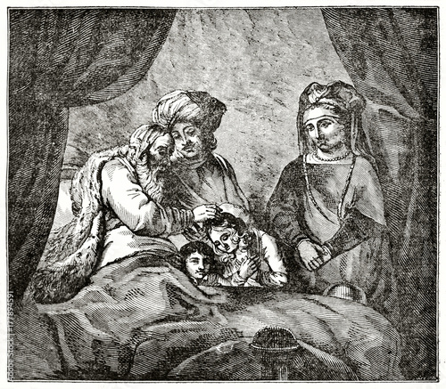 Old grayscale illustration of a aged man in his bed giving a bless to a child. The Blessing of Jacob. Created by Jackson after Rembrandt, published on Penny Magazine, London, 1835