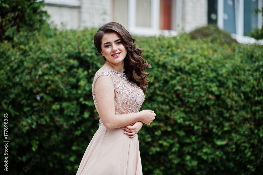 Portrait of a beautiful and gentle girl in elegant gown posing outdoor. Portrait of a beautiful and gentle girl in elegant gown posing outdoor.