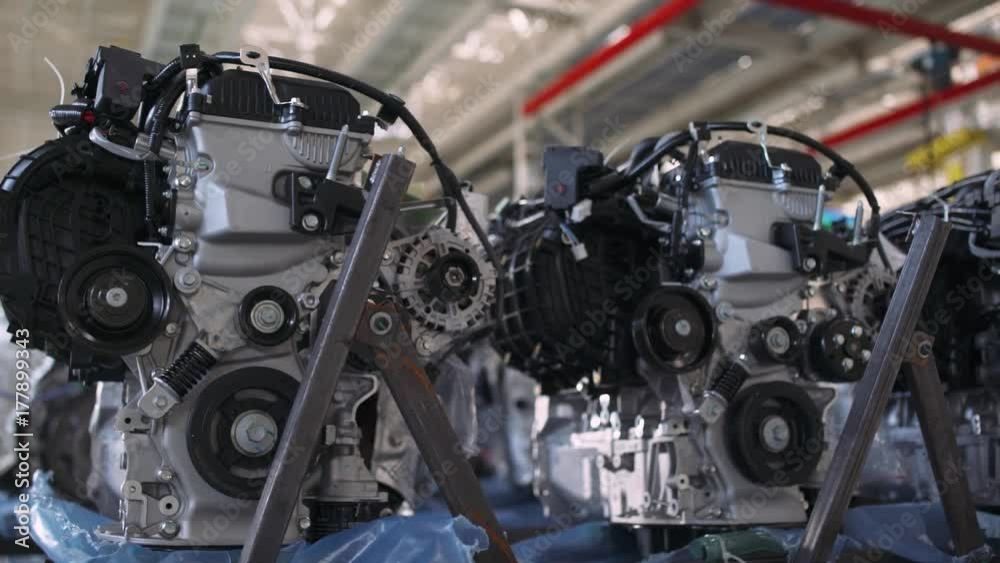 Automobile plant, view of power units and engines for a new car, modern production of cars, automated production line.
Automobile plant, view of power units and engines for a new car, modern production of cars, automated production line.