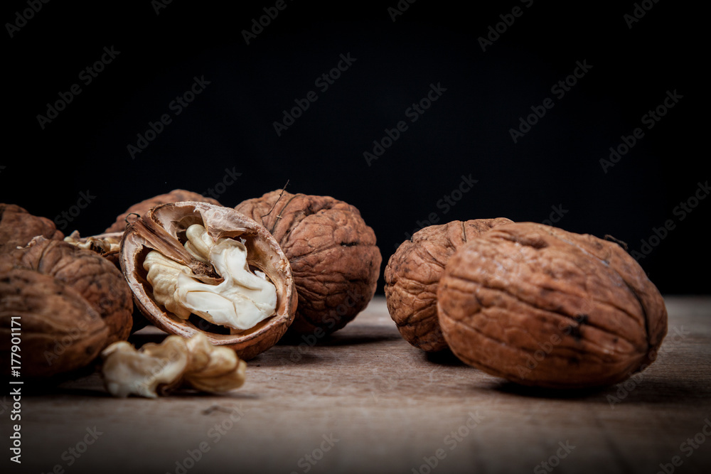 walnuts (Juglans regia) detail on black background walnuts (Juglans regia) detail on black background