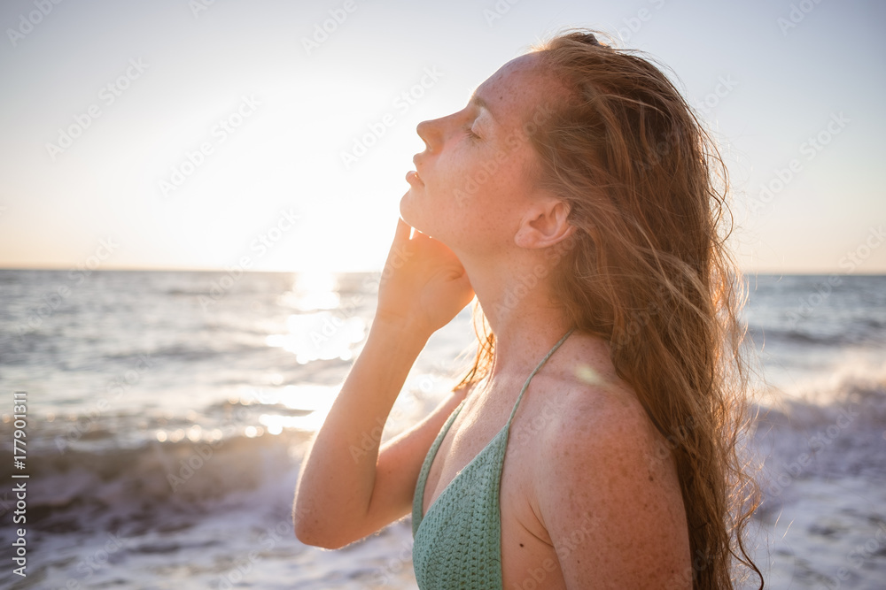 young slim beautiful woman on sunset beach, happy, photo toned young slim beautiful woman on sunset beach, happy, photo toned