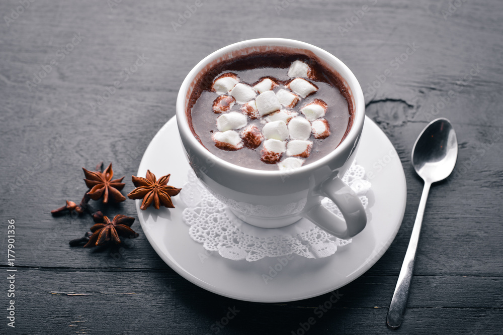 Cappuccino with marshmallow. On a wooden background. Top view. Free space for your text. Cappuccino with marshmallow. On a wooden background. Top view. Free space for your text.