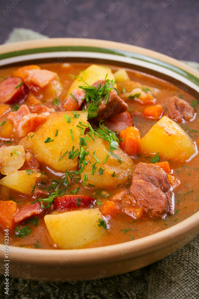 Tasty stew. Goulash soup bograch in a bowl. Hungarian dish, vertical Tasty stew. Goulash soup bograch in a bowl. Hungarian dish, vertical