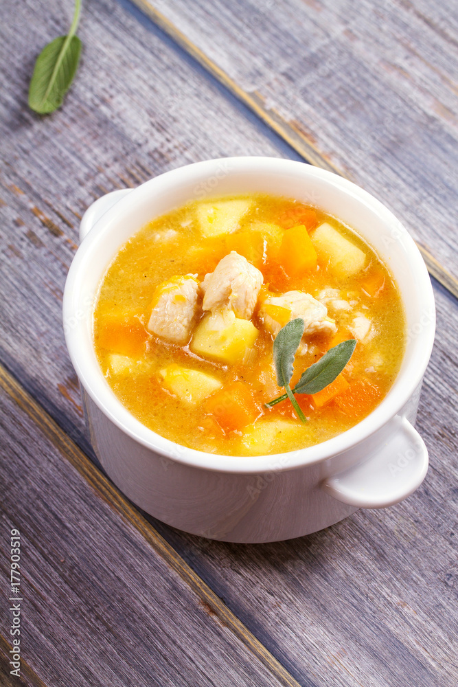 Chicken, butternut, apple ginger and sage stew. Pumpkin and chicken breast soup, vertical Chicken, butternut, apple ginger and sage stew. Pumpkin and chicken breast soup, vertical