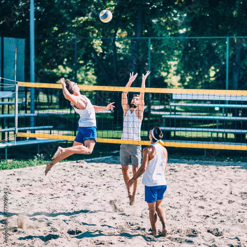Beach volleyball detail - Males on the net