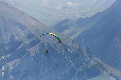 one paraglider in Bernese Alps within mountains