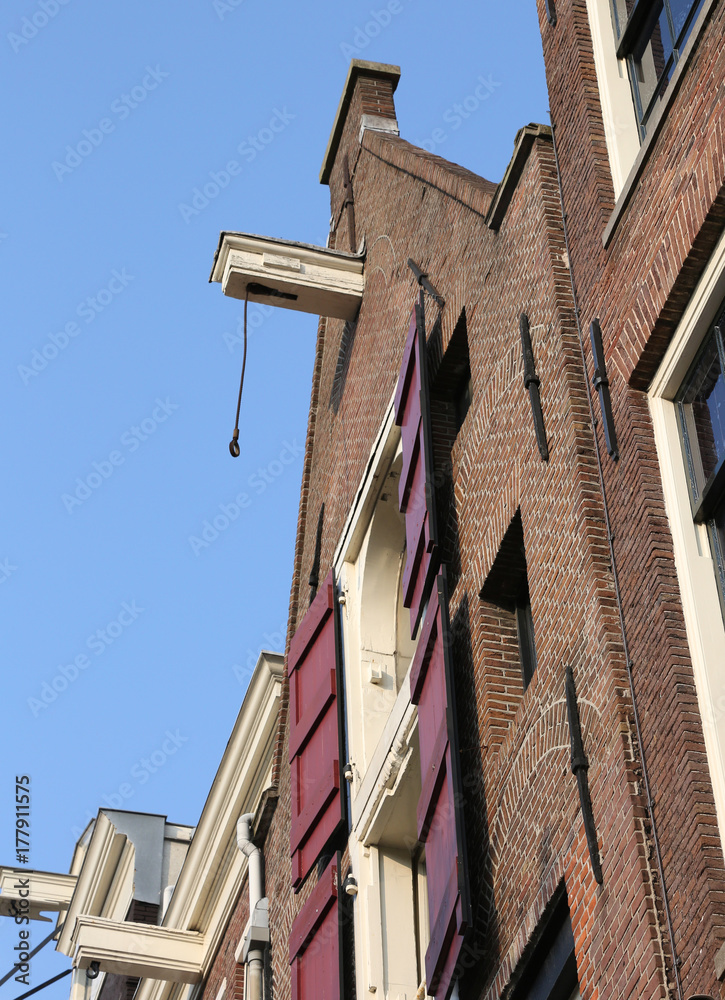 Fototapeta premium amsterdam house with hook near the roof to carry the furniture