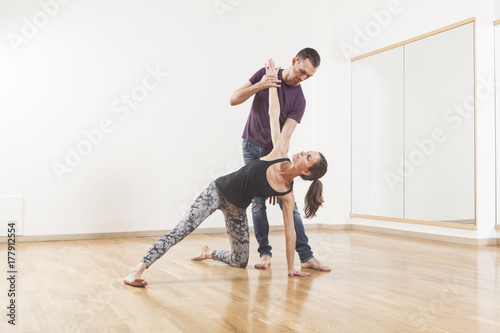 Pilates instructor coaching a young beautiful woman © Tommaso Lizzul