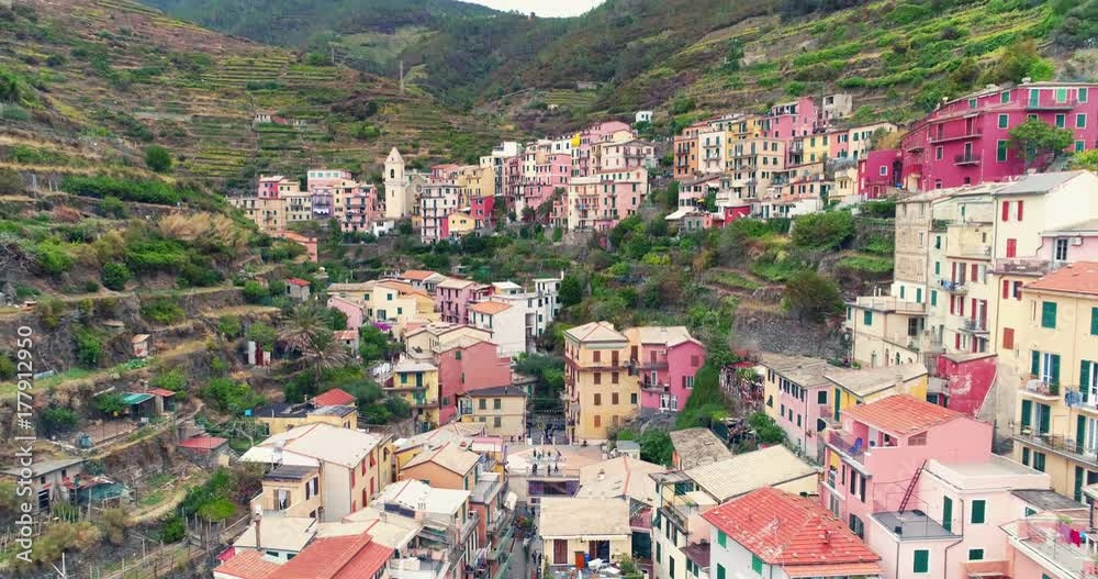 Amazing aerial view of Manarola village on cliff rocks and turquoise sea.Stunning view of beautiful and cozy town in Cinque Terre Reserve,Liguria,Italy,Europe.Travel destination, adventure concept. Amazing aerial view of Manarola village on cliff rocks and turquoise sea.Stunning view of beautiful and cozy town in Cinque Terre Reserve,Liguria,Italy,Europe.Travel destination, adventure concept.