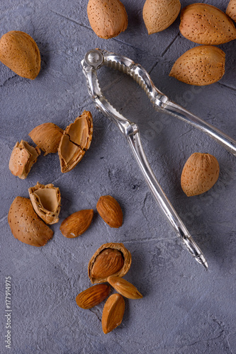 Almonds and nutcracker. Tasty snack