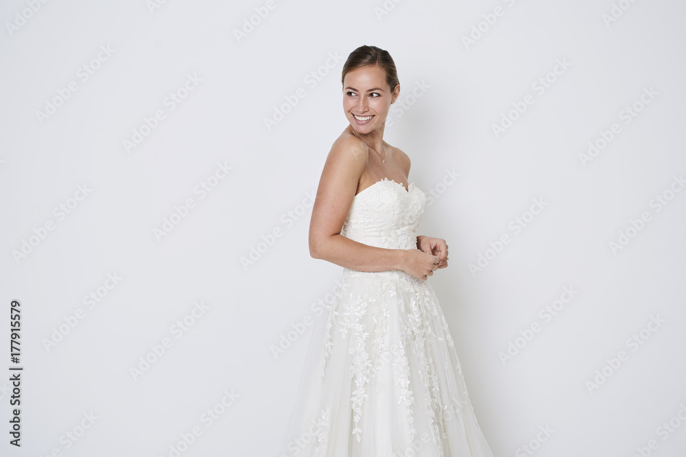Beautiful bride in white wedding dress, studio Beautiful bride in white wedding dress, studio