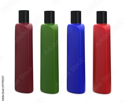 Colored bottles for shampoo on a white background