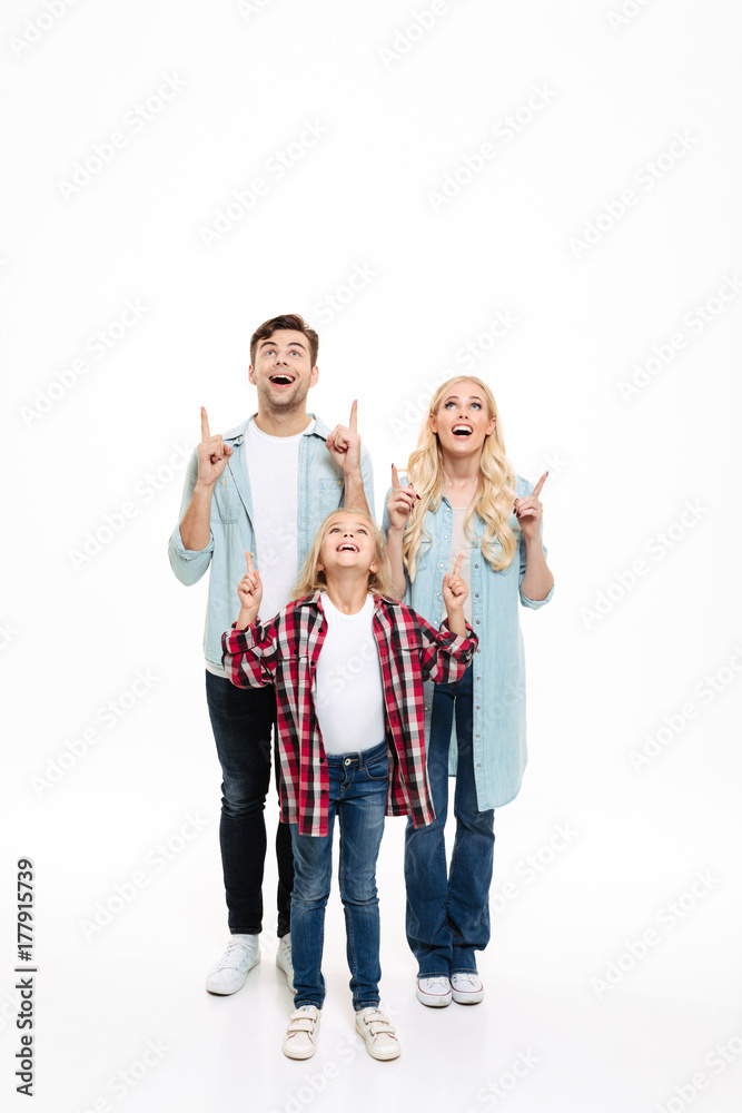 Full length portrait of an excited family with a child