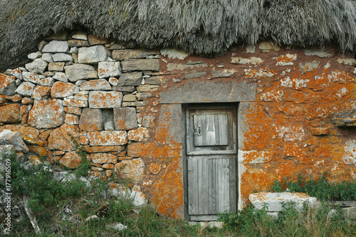 Close up of the entrance of an abandoned shack
