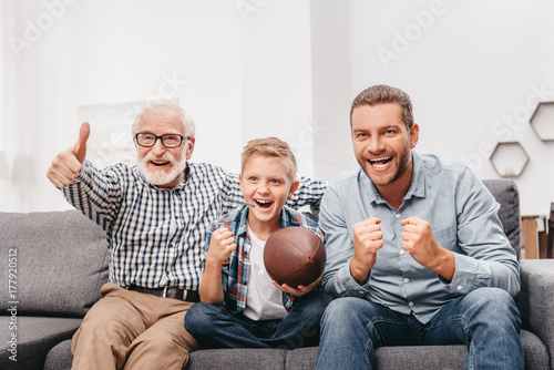 Family watching football at home