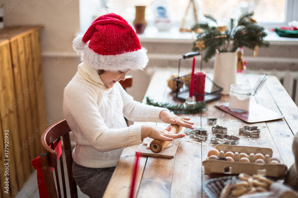funny child girl preparing cookies, lifestyle, real nordic interior, rustic style, the brown