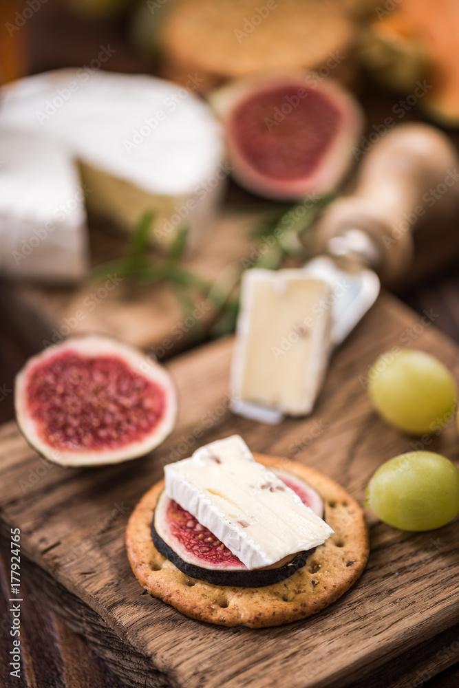 Cheese crackers with camembert and fresh fig