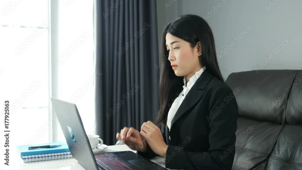 4k of young Asian Business woman working on laptop computer in office. 4k of young Asian Business woman working on laptop computer in office.