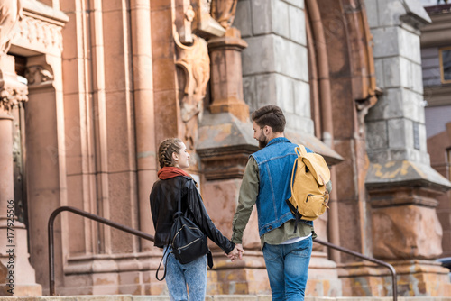 fashionable couple walking on street