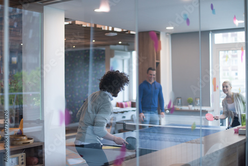 startup business team playing ping pong tennis