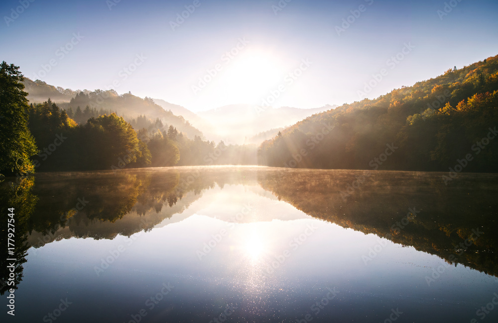 Sunrise on the lake in autumn nature.