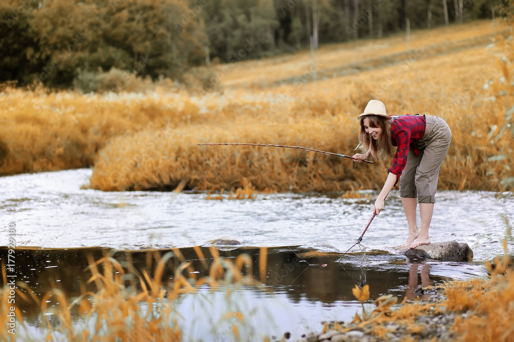 Girl in autumn with a fishing rod Girl in autumn with a fishing rod