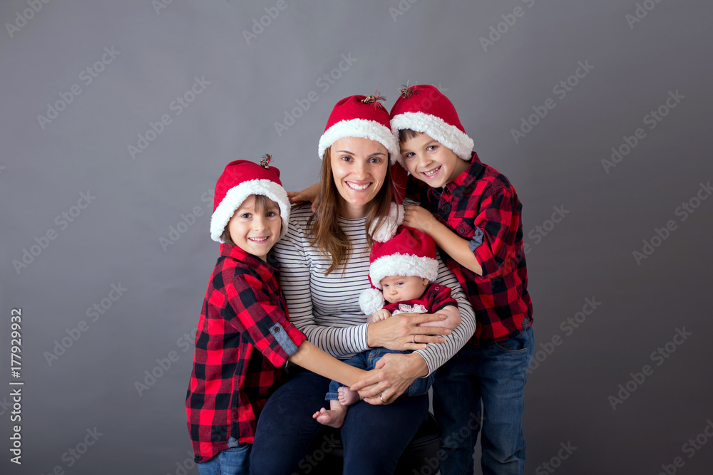 Family christmas portrait, isolated on gray, studio image Family christmas portrait, isolated on gray, studio image
