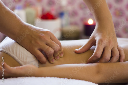 Wallpaper Mural Closeup detail of hands massaging the baby's shoulder and back. Torontodigital.ca