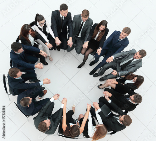 concept of team building.large business team sitting in a circle