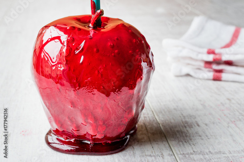 Candy Apples on white wooden surface. Ready to Eat photo