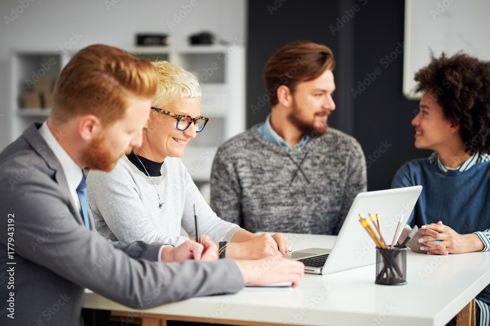 Multi-ethnic team working in modern office Multi-ethnic team working in modern office
