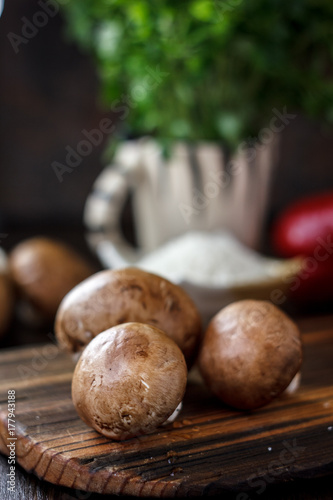 Food - mushrooms on wooden board on kitchen.