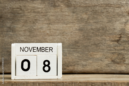 Fototapeta Naklejka Na Ścianę i Meble -  White block calendar present date 8 and month November on wood background