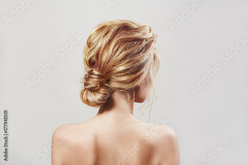 Back view of blondi woman with long hair