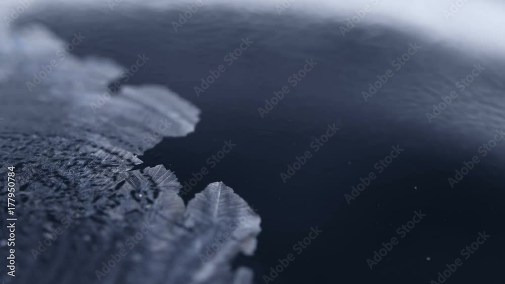 Freezing soap bubble close-up, winter holidays background,