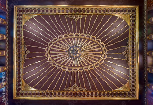Wooden golden ornate ceiling with design based on sun rays inspired by the old flag of the ottoman empire at the public mosque of The Manial Palace of Prince Mohammed Ali Tewfik, Cairo, Egypt photo