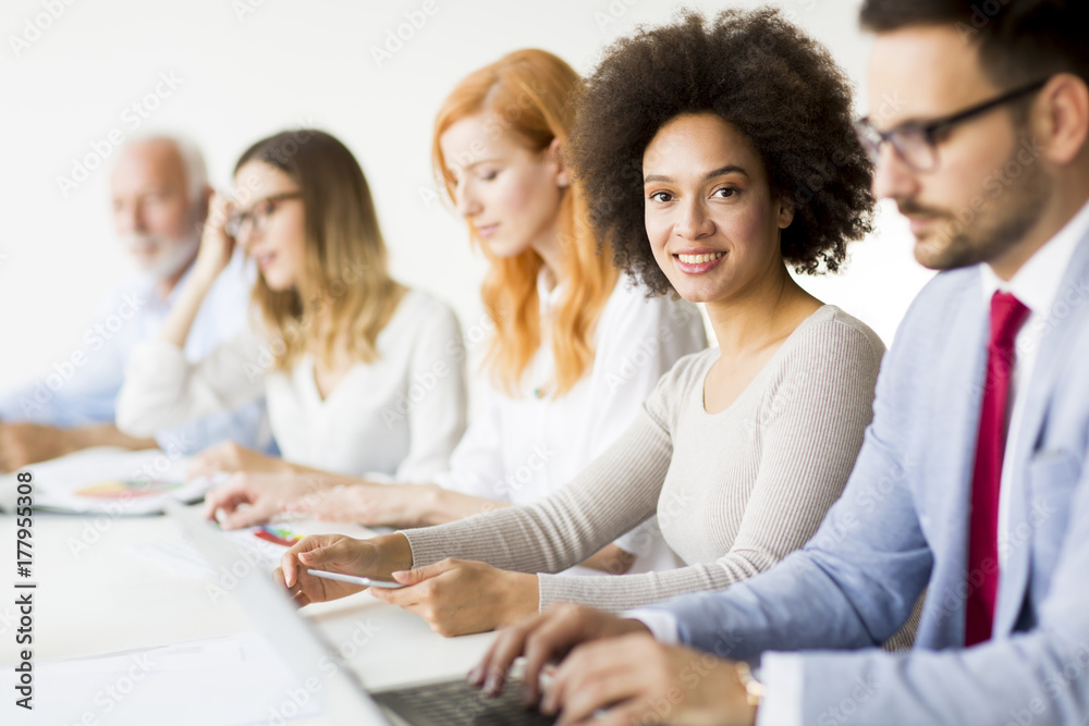 Joyful multiracial business team at work in modern office Joyful multiracial business team at work in modern office