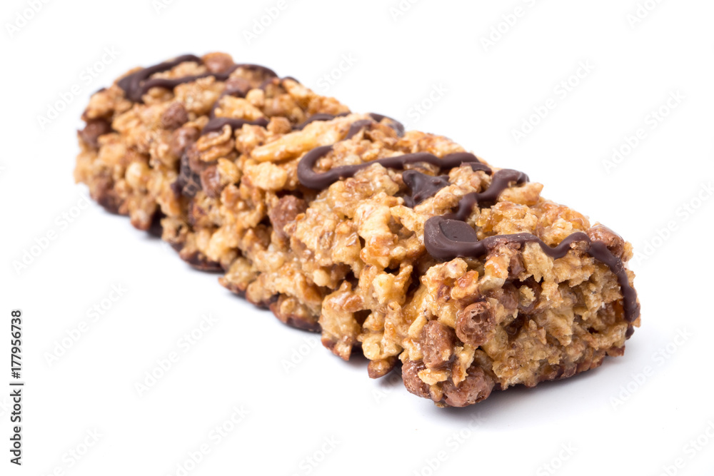 Chocolate cereal bars with wheat whole grain and chocolate on a white background. Chocolate cereal bars with wheat whole grain and chocolate on a white background.