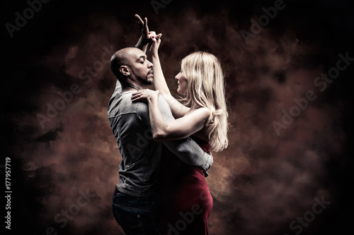 Young couple dances Caribbean Salsa photo