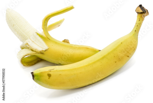 One whole banana, one opened, isolated on white background photo