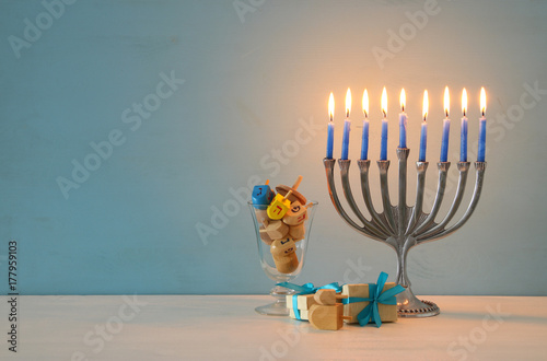 image of jewish holiday Hanukkah background with traditional spinnig top, menorah (traditional candelabra)