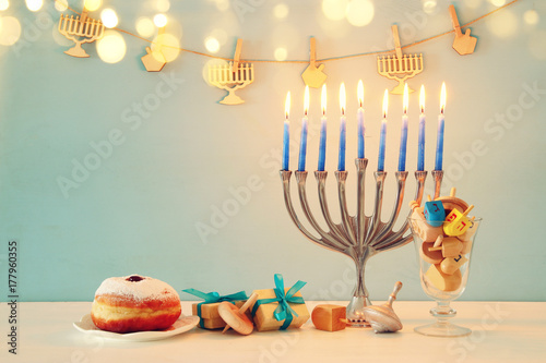 image of jewish holiday Hanukkah background with traditional spinnig top, menorah (traditional candelabra)