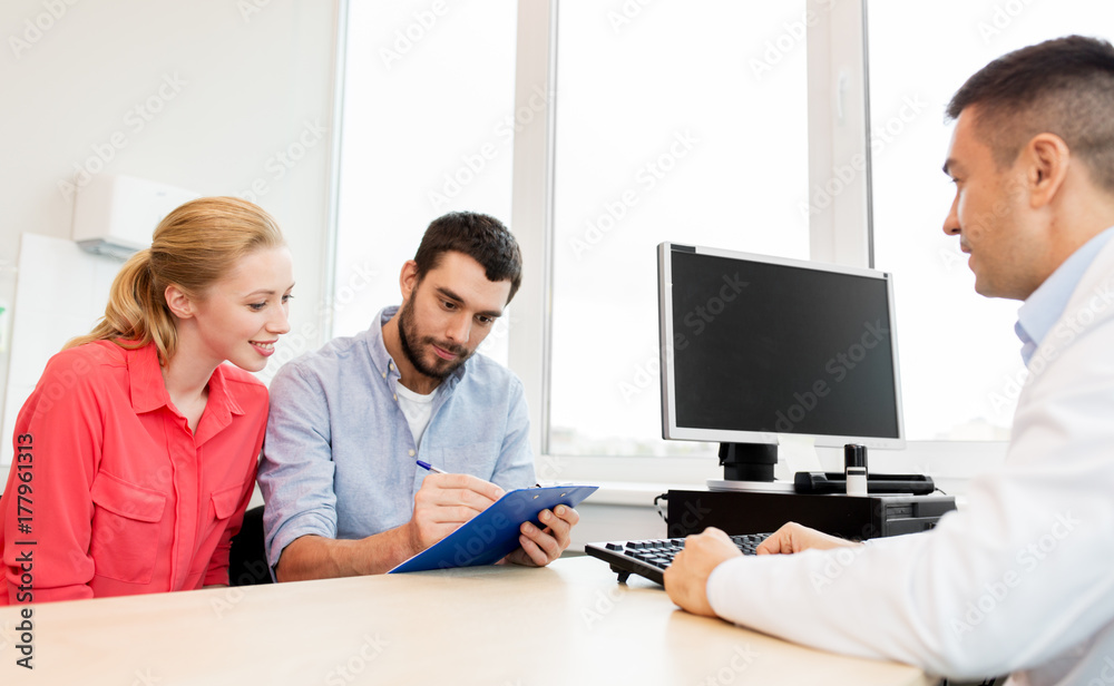 couple visiting doctor at family planning clinic couple visiting doctor at family planning clinic