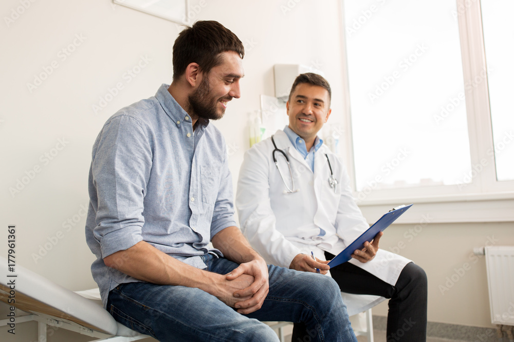 smiling doctor and young man meeting at hospital smiling doctor and young man meeting at hospital