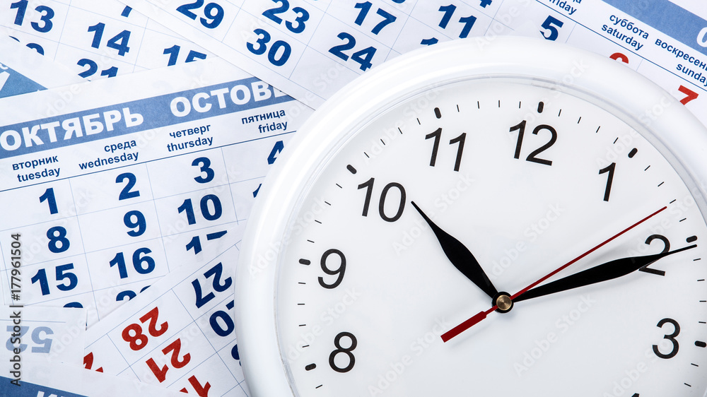 clock with wall calendar sheets with the number of days clock with wall calendar sheets with the number of days
