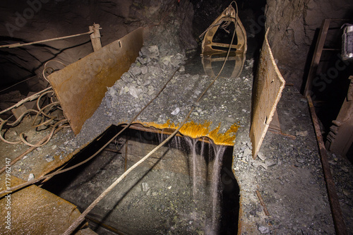 Scraper loader slide at the iron ore mine shaft