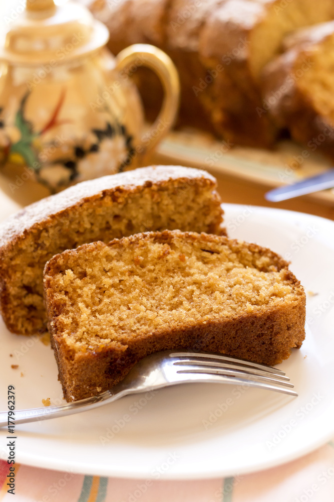 sweet almond homemade cake on white plate with coffee sweet almond homemade cake on white plate with coffee