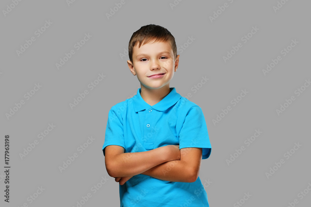 Studio portrait of a teenage boy with crossed arms. Studio portrait of a teenage boy with crossed arms.